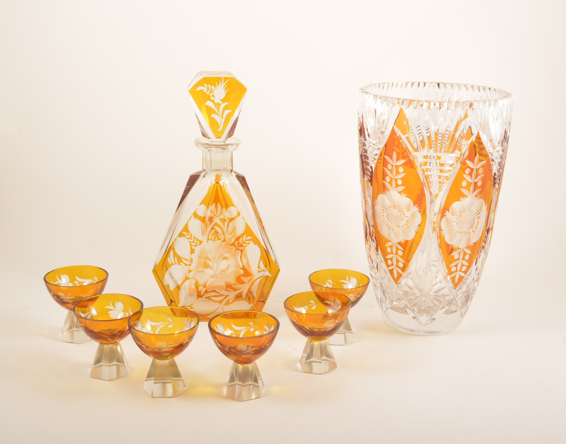 Amber overlaid glass vase, brandy balloon, liqueur set.