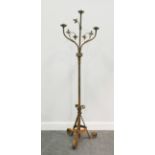 Gothic style wrought iron standard three branch candelabra, height 167cm.