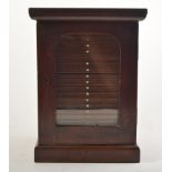 Victorian mahogany collectors cabinet, arched glazed door enclosing drawers.