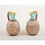 Pair of Royal Doulton Lambeth Silica ware jugs, with trefoil necks, 18cm,