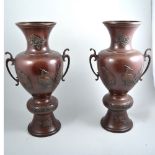 A pair of Japanese bronze baluster vases,