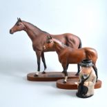 A Beswick matt brown Connoisseur racehorse on a wooden plinth,