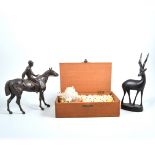 A quantity of carved wooden figures, tureen boxes, spelter figure of a man on horseback,