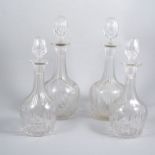 Two pairs of glass wine decanters each with narrow slender necks and concave fluting,