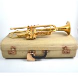 Brass trumpet, retailed by Leslie Shepard, Burgess Hill, Essex, in hard shell case.