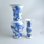 Chinese blue and white beaker vase, decorated with a floral band within stiff leaf borders,
