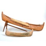 A wooden modern sailing vessel, and similar model canoe,