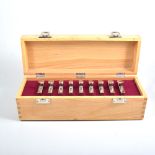A cased set of nine peg markers for a shoot, each marker in the form of a stainless steel 2oz,