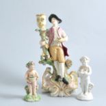 Derby Putti; another and a candlestick figure,