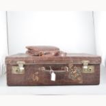 A vintage alligator handbag and a pressed alligator effect suitcase 38cm x 61cm x 19cm.