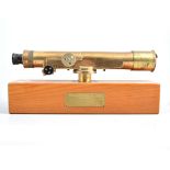 A lacquered brass surveyors telescope, and level, on presentation plinth, scope 33cm long.