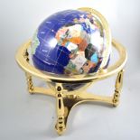An ornamental gemstone globe,