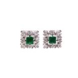 A pair of emerald and diamond square cluster earstuds,