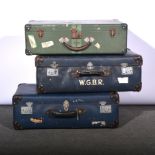 Three large blue Globetrotter suitcases and a medium green metal suitcase, (4).