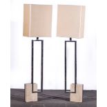 A pair of Cubist floor lamps, late 20th century, open rectangular chrome columns,