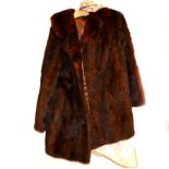 Two fur coats and two fur stoles