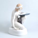 A Rosenthal porcelain figure of a maiden gathering pearls,