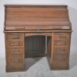 American style oak roll top desk, W122cm, D68.5cm, H119cm.