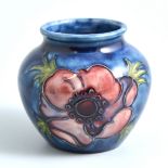 A small Moorcroft blue ground vase, blue ground Anemone pattern,