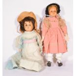 Two early celluoid/plastic head dolls, one with weighted eyes and kid body, 43cm tall,