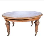 Victorian oak extending dining table, the top with a moulded edge, plain frieze,