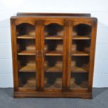 Pair of oak bookcases, circa 1940, rectangular top with shallow back, moulded edge,