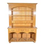 Modern oak dresser, three shelf back with six spice drawers, above a moulded rectangular top,