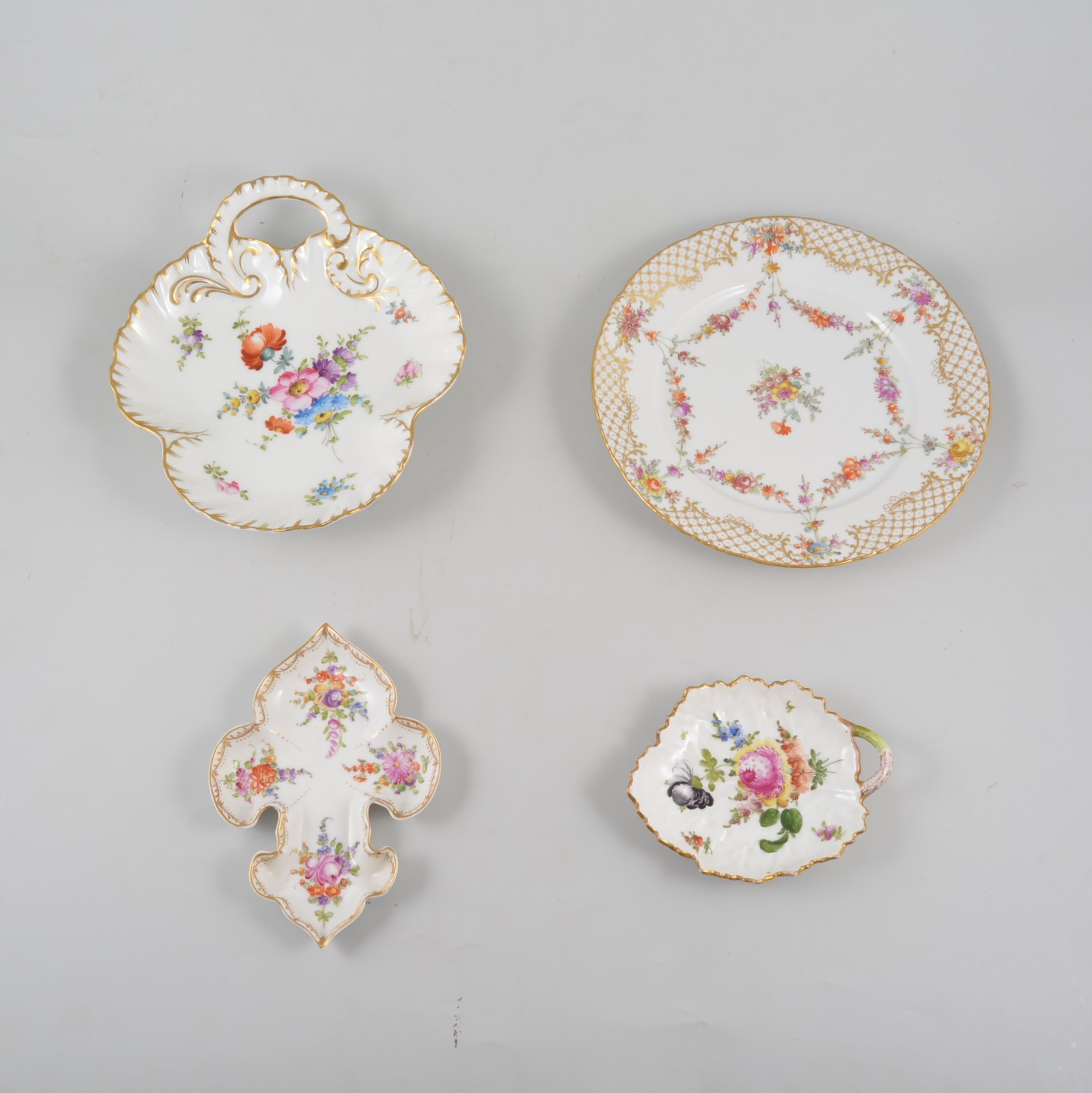 Quantity of Dresden and Continental porcelain dishes and plates, handpainted with floral designs,