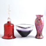 Cranberry glass bell, a lustred glass dimple vase and an Art glass bowl.