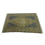 Mosul pattern rug, lozenge medallion on a fawn field border within guards,