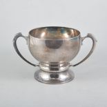 A large silver twin handled pedestal cup,