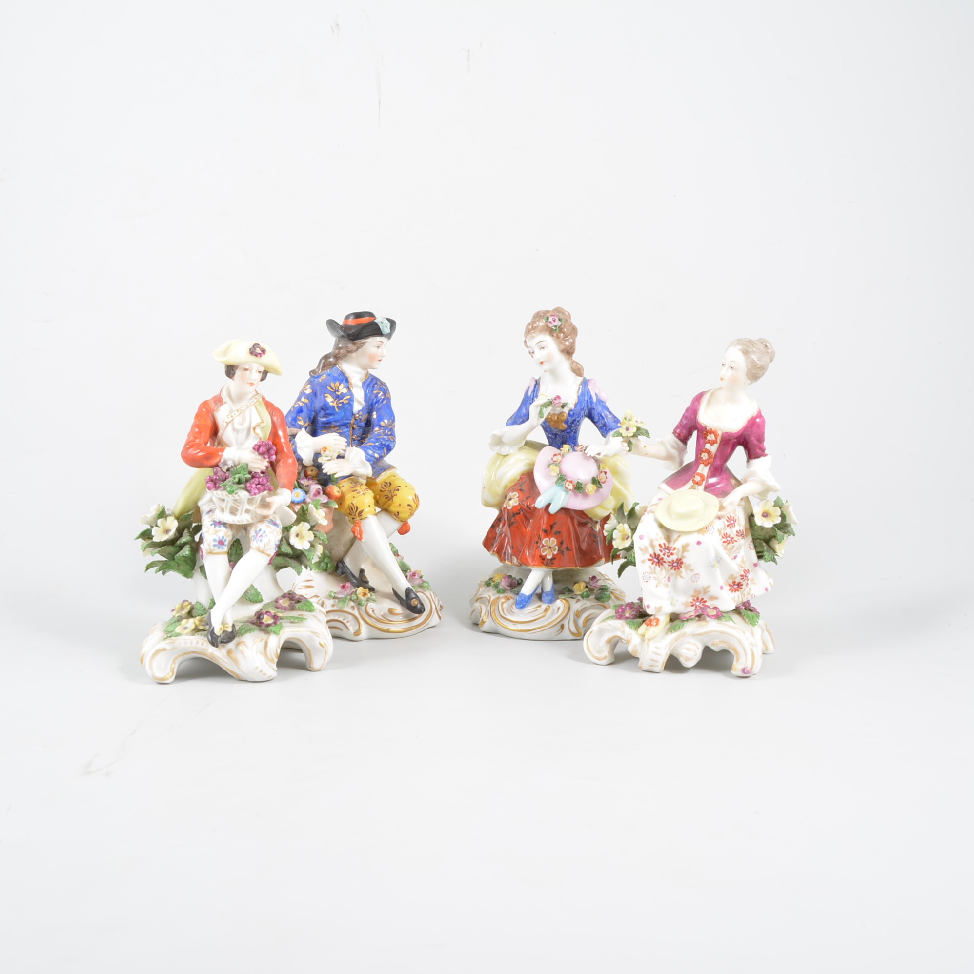 Pair of Chelsea style porcelain figures of gardeners, Continental 20th Century,