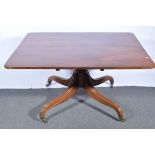 Regency mahogany breakfast table, rectangular tilt top with rounded corners,