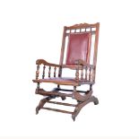 American style stained wood rocking chair, maroon leather pads, width 60cm.