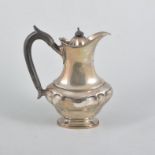 A silver coffee pot, plain polished oval Queen Anne style panelled body on a single oval foot,