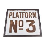 A railway platform sign, brown lettering on white enamel "PLATFORM No 3",