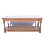 Ercol coffee table, rounded rectangular top, turned supports, joined by an undertier,