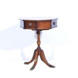 Octagonal red tooled leather topped side table, diameter 49 cm, height 61cm.
