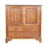 Late 20th Century oak television and media cabinet, cupboards with linen fold panels,