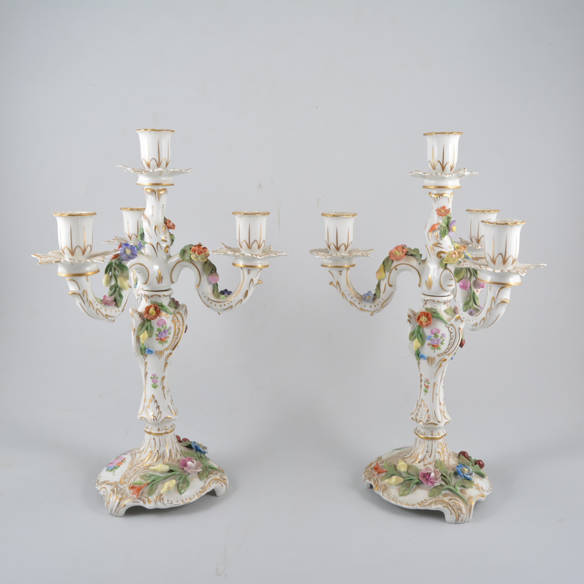 Pair of Dresden four light candelabra, with floral decoration.