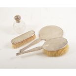 Victorian silver mounted scent bottle and five piece silver backed dressing table set.