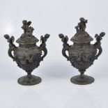 Pair of cast metal urns, French 20th Century, Rococo style, winged cherubs, birds and floral swags,