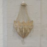 Three French style shield shaped wall light fittings with droplets.