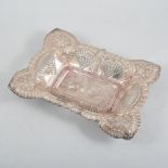 An Edwardian pierced silver dish, triangular pierced panels,