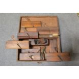 Collection of carpenters moulding planes and ammunition box.