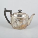 A Victorian Scottish oval silver teapot, repousse chased with floral and foliate decoration,