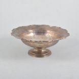 A silver pedestal dish, plain polished finish with a scalloped border on single round foot,