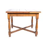 Oak draw-leaf dining table, square top, plain frieze, turned legs joined by cross stretchers,