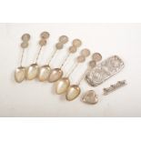 Set of six Chinese teaspoons inset coins, baby heart-shaped rattle, bar brooch, etc.