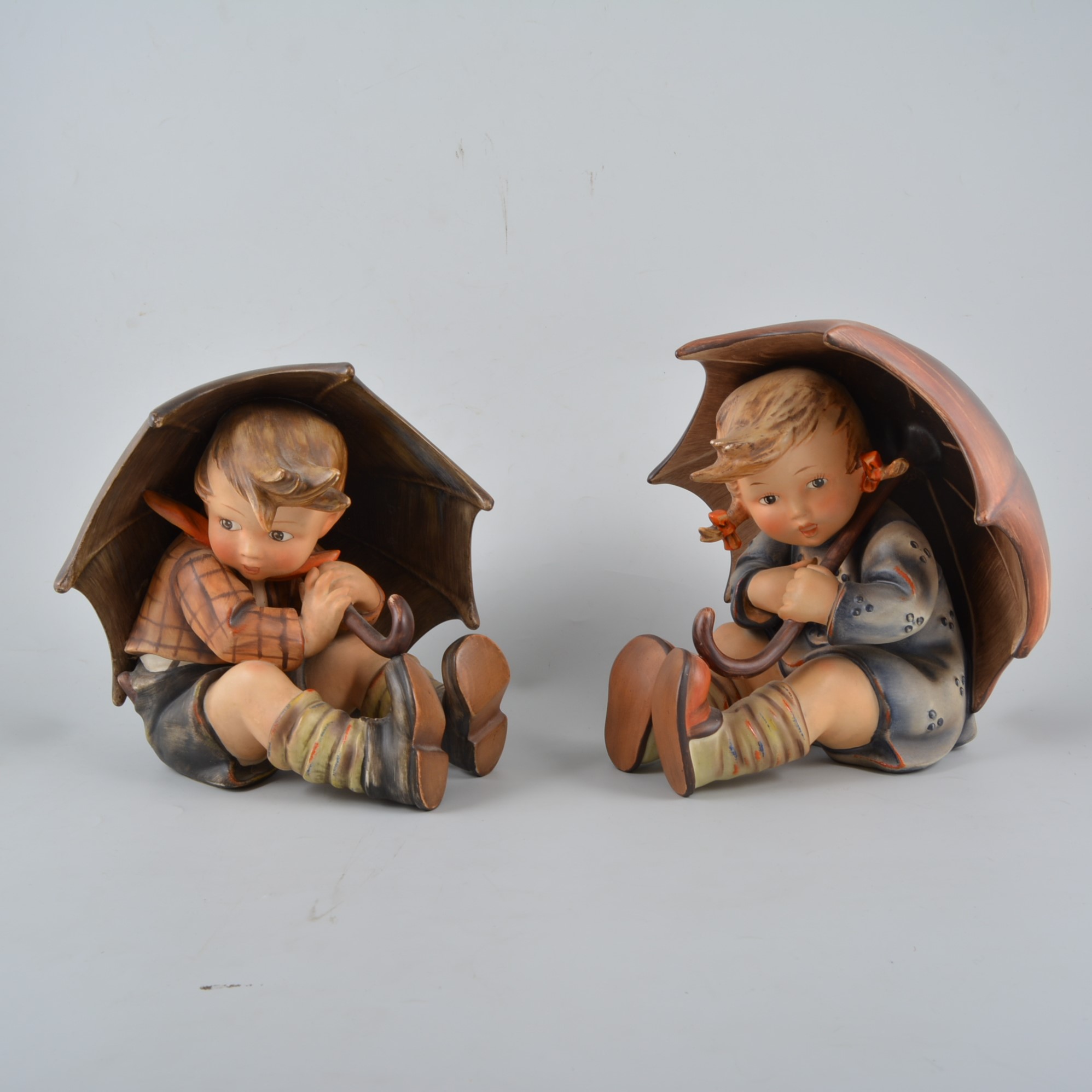 Pair of oversize Goebel Hummel figures of Umbrella Boy and Umbrella Girl, numbers 152A, 152B,